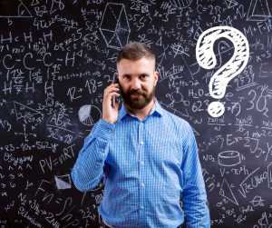 Glenhaven Park Camps A man with a beard stands in front of a chalkboard filled with mathematical equations and symbols, holding a phone to his ear. A large question mark hovers above his head, as if he's contemplating an adventure at the Glenhaven Park Campsite.